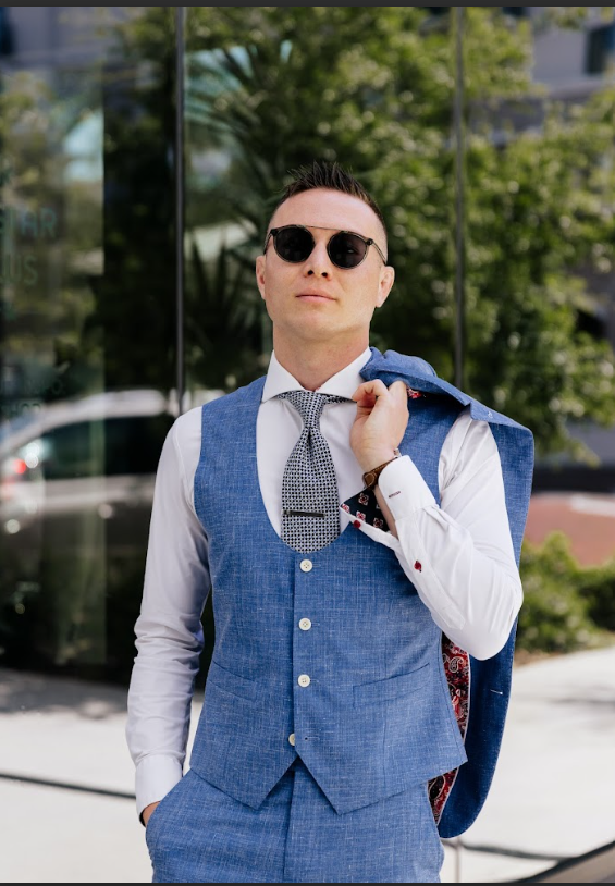 A flat-lay or "outfit of the day" (OOTD) style image featuring a unique mix of vintage and modern clothing that represents a specific personal identity.